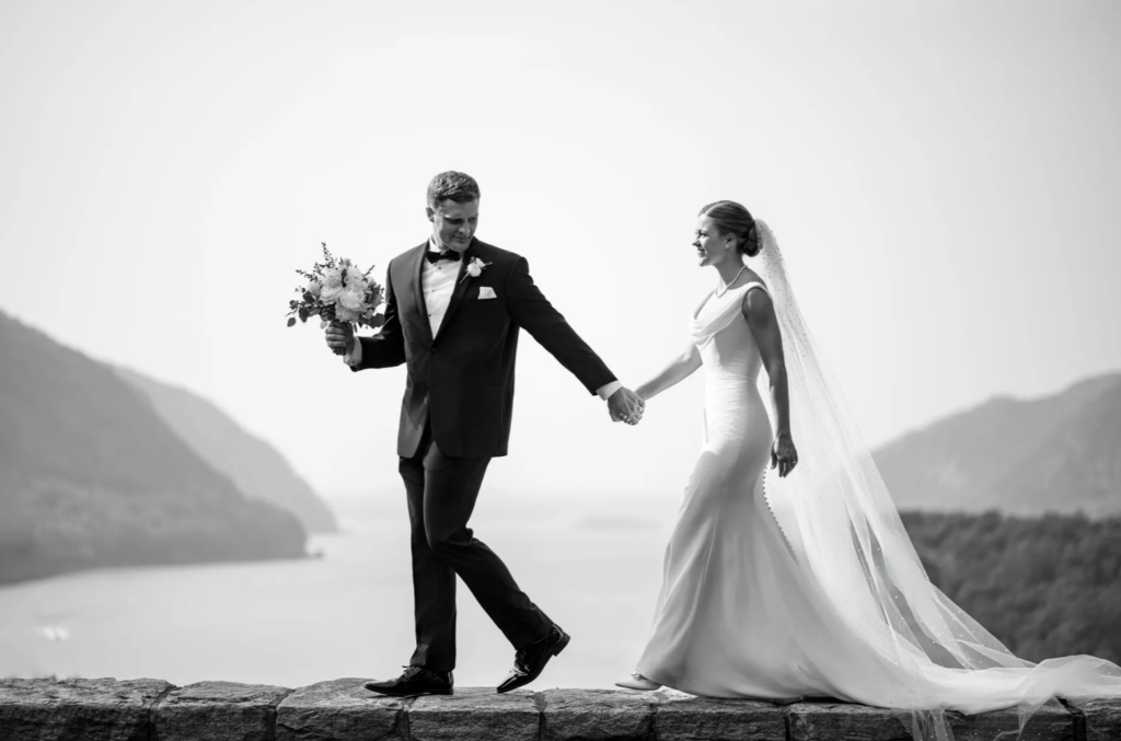 Bride and groom posing for fashion-inspired wedding portrait outdoors