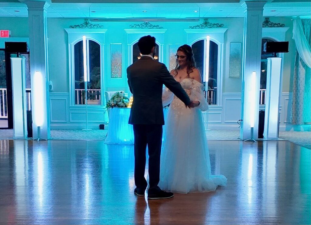 Bride and Groom celebrating their first dance at a ballroom wedding reception