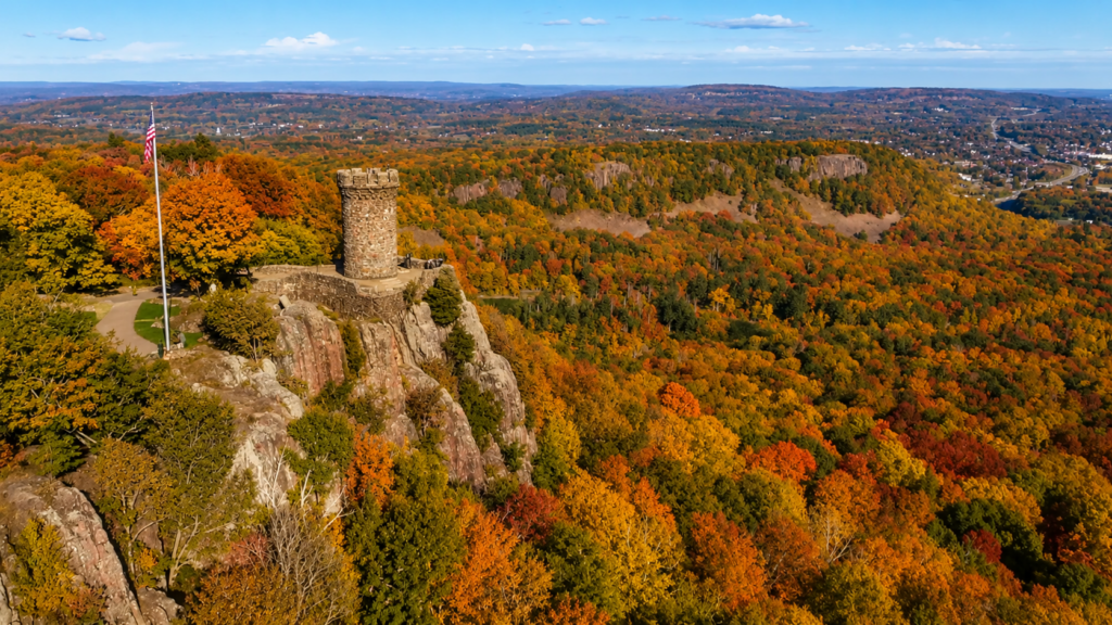 Castle Craig at Hubbard Park in Meriden, Connecticut surrounded by fall foliage.